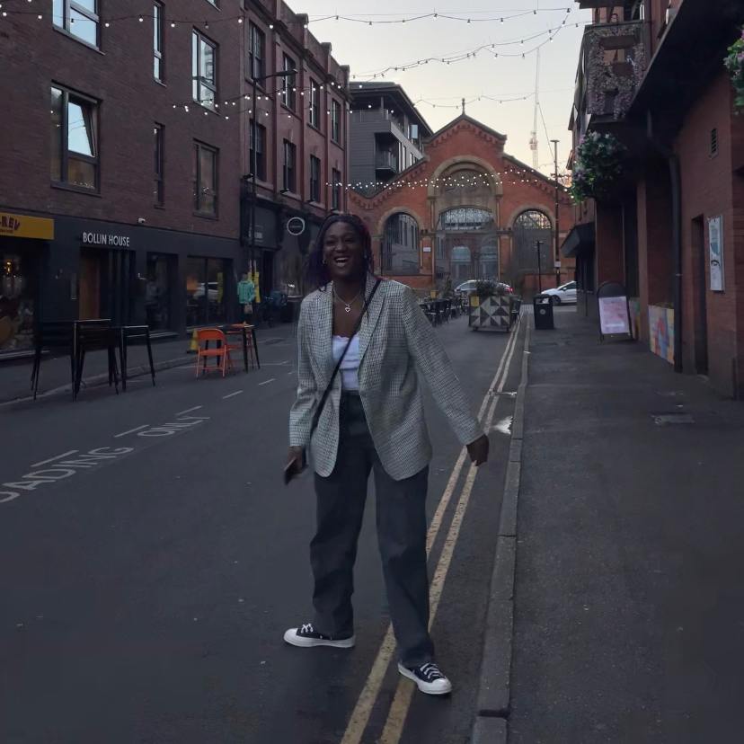 Wise stood on street in Manchester's Northern Quarter