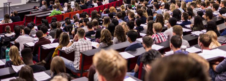 A photo of a lecture theatre full of students.